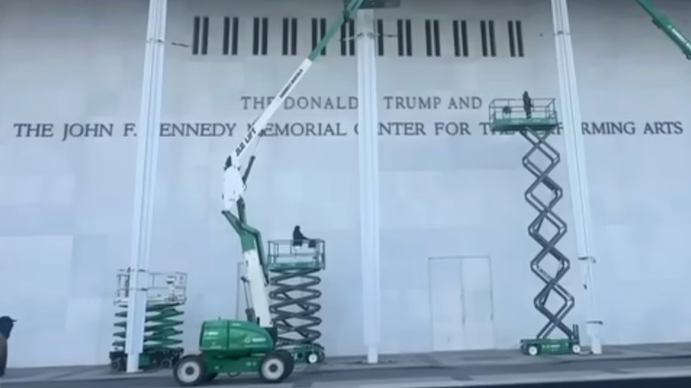 Workers adding Donald Trump's name to the Kennedy Center in Washington D.C.