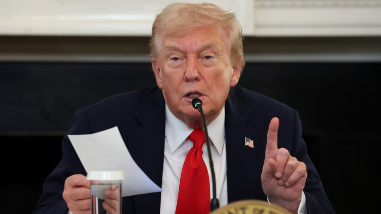 Donald Trump speaking with finger pointed upward