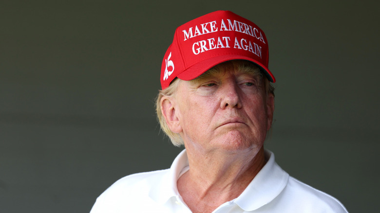 Donald Trump wearing a red Make America Great Again hat