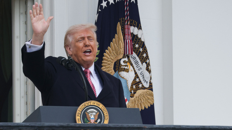 Donald Trump talking and waving