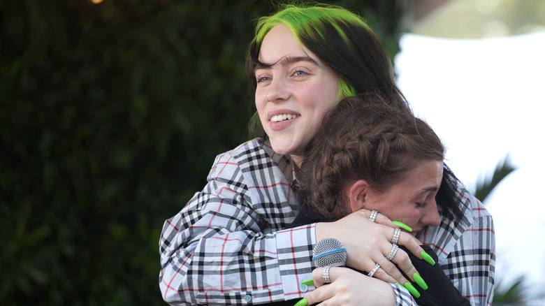 Billie Eilish hugging a fan