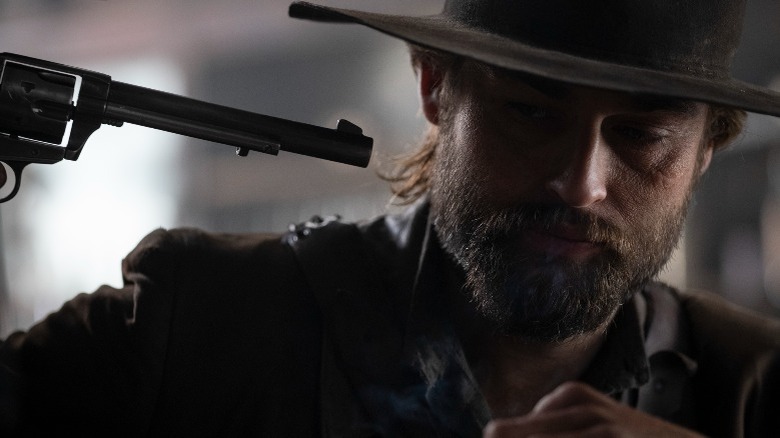 Douglas Booth with a gun to his head