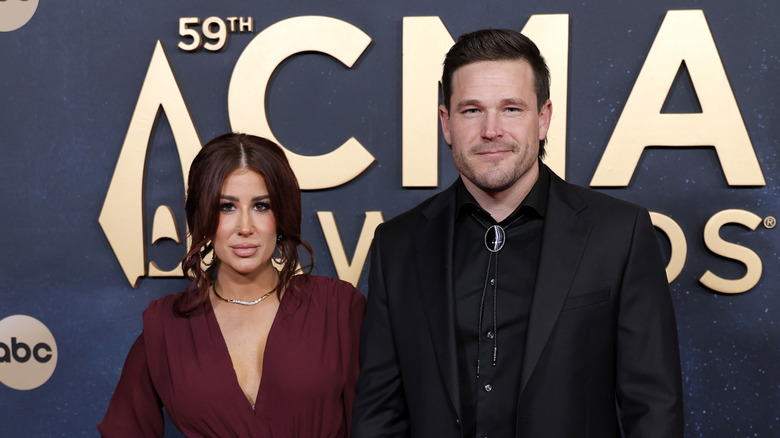 Chelsea and Cole DeBoer from HGTV's "Down Home Fab" posing at the 59th CMA Awards
