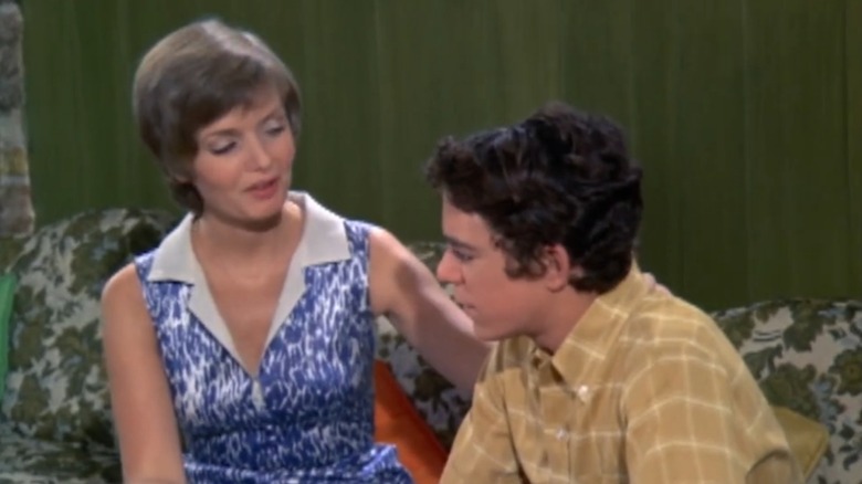 A scene from an episode of "The Brady Bunch" featuring Florence Henderson and Barry Williams