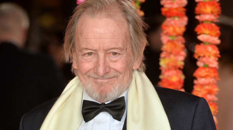 Ronald Pickup smiling at event