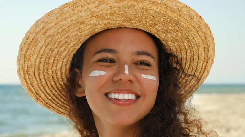 A woman with sunscreen on