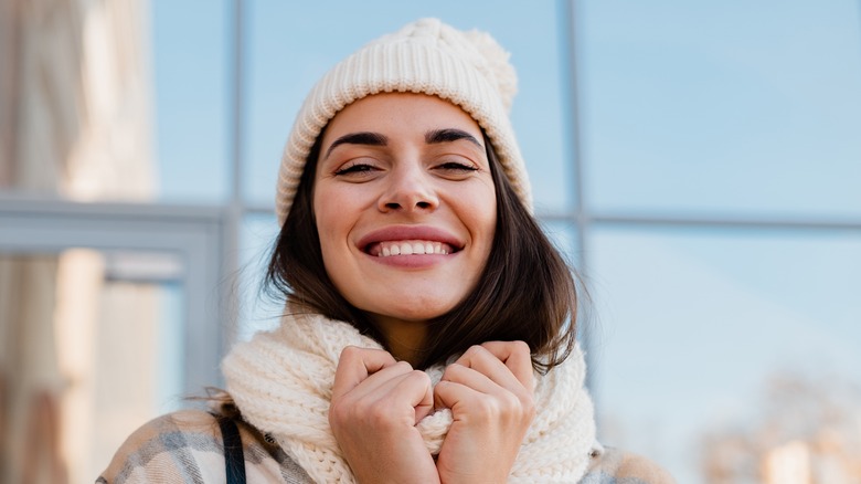 A smiling woman in winter clothing