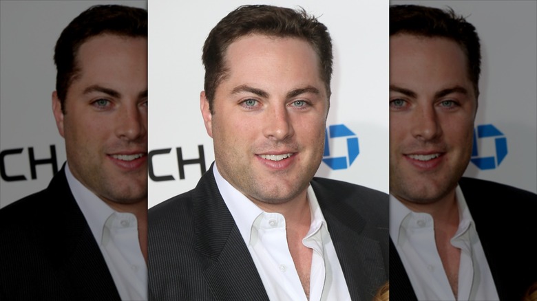 Dr. Phil's oldest son Jay McGraw posing at a gala in 2013
