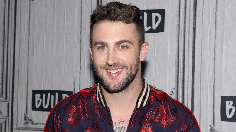 Jordan McGraw smiling on the red carpet