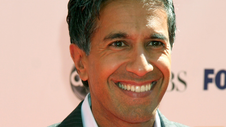 Dr. Sanjay Gupta smiling on red carpet