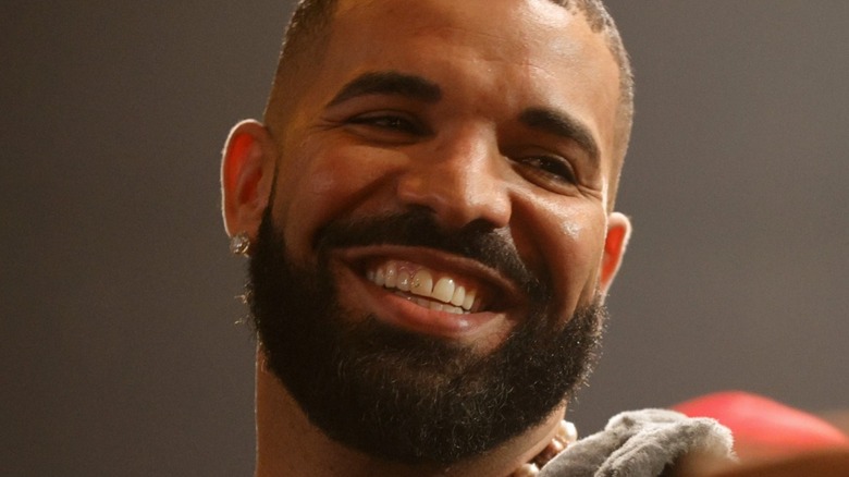 Drake smiling at concert