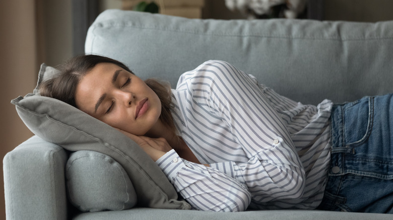 Woman napping on couch