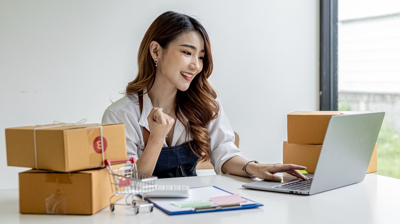 Happy woman shopping online 