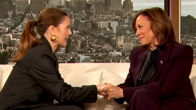 Drew Barrymore holding Kamala Harris' hands