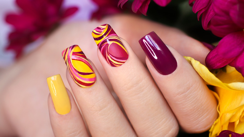 Woman with multi-colored nails