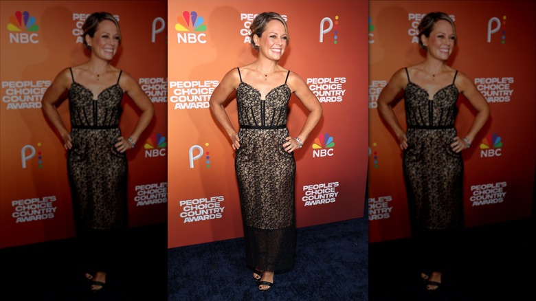 Dylan Dreyer poses with her hands on her hips in a black lace dress with spaghetti straps.