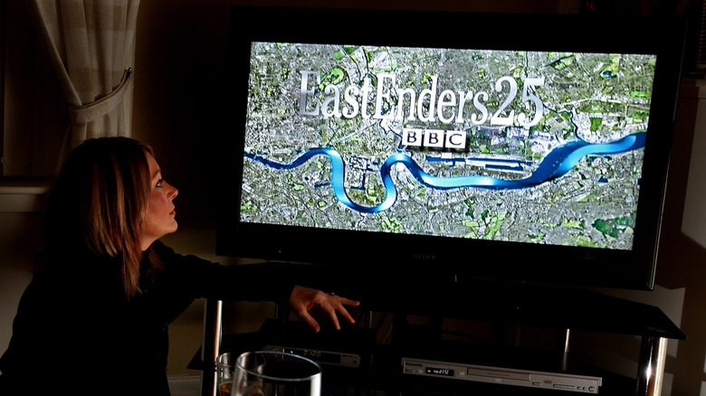 Woman watches EastEnders 25th anniversary episode