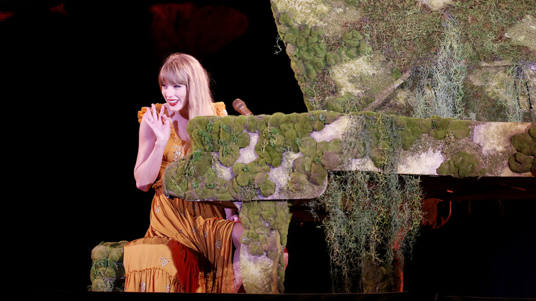 Taylor Swift singing at the piano