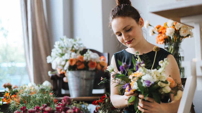 Woman arranging flowers 