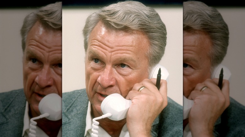 Eddie Albert taking phone calls during a political telethon in 1968