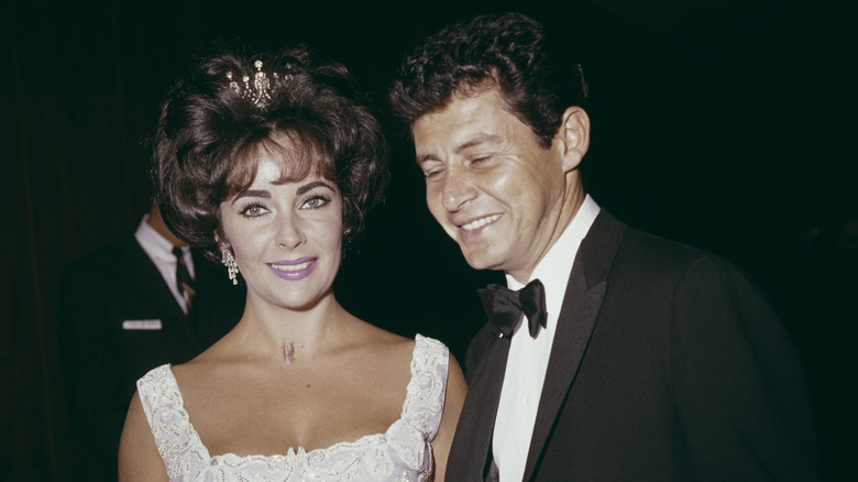 Eddie Fisher and Elizabeth Taylor posing at the Academy Awards, Los Angeles, California, circa 1960.