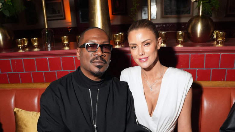 Eddie Murphy and Paige Butcher sitting