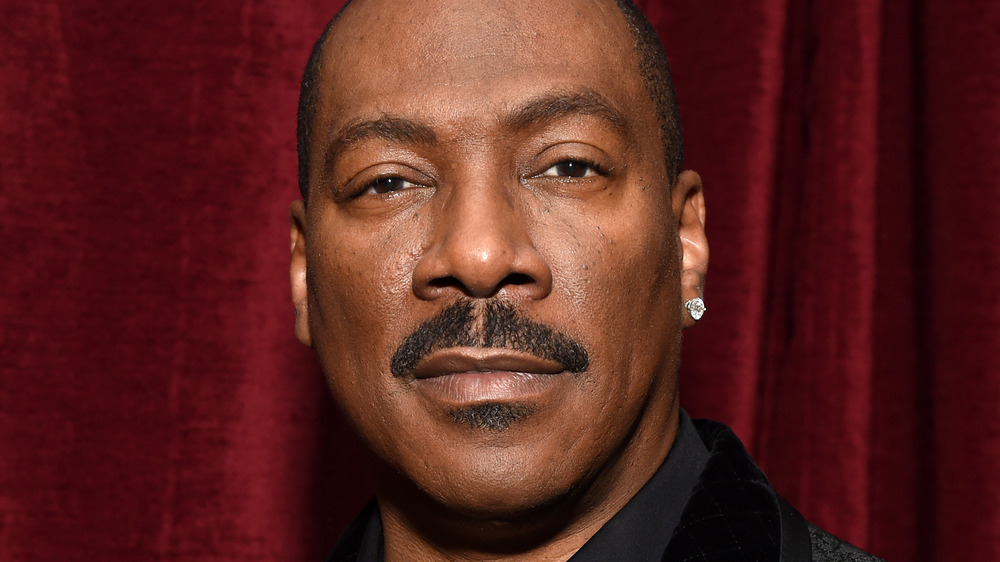 Eddie Murphy poses at an event