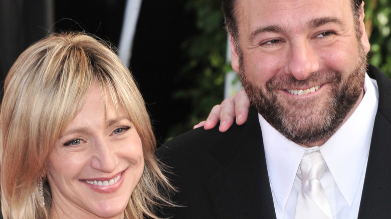 Edie Falco and James Gandolfini smile together