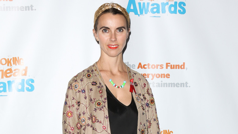 Naomi Wilding poses on a red carpet