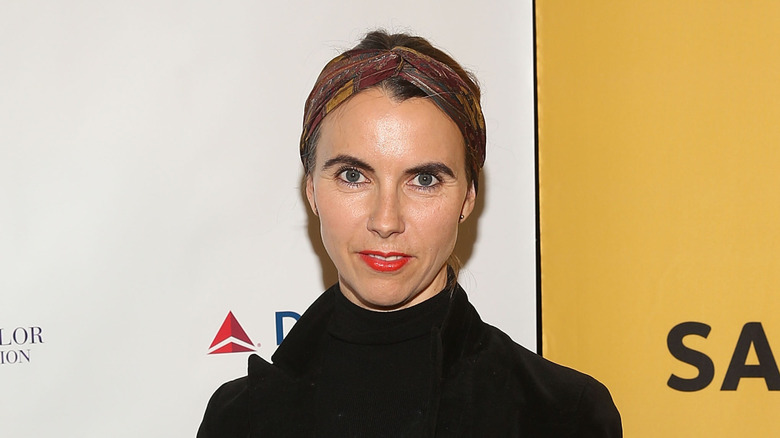 Naomi deLuce Wilding posing at a gala