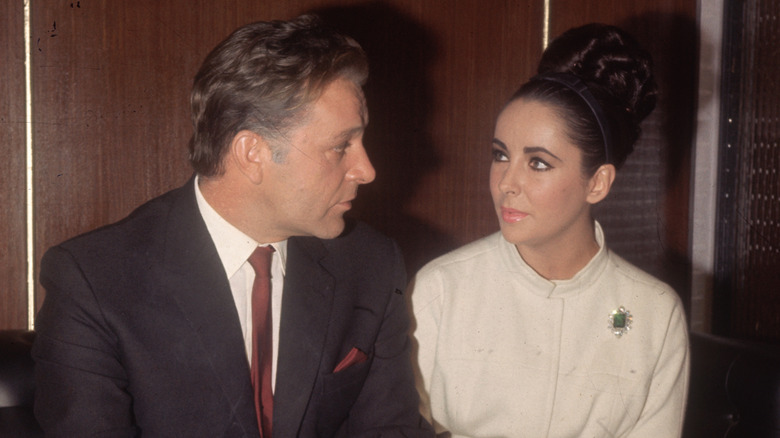Richard Burton and Elizabeth Taylor looking at each other.