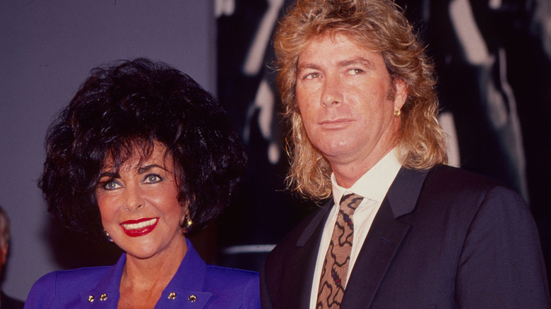Larry Fortensky and Elizabeth Taylor attending an event