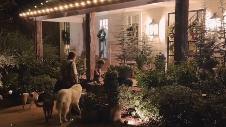 Ella Gaines walking into house with dogs