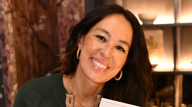 Joanna Gaines smiling while attending "The Stories We Tell" book launch luncheon in 2022
