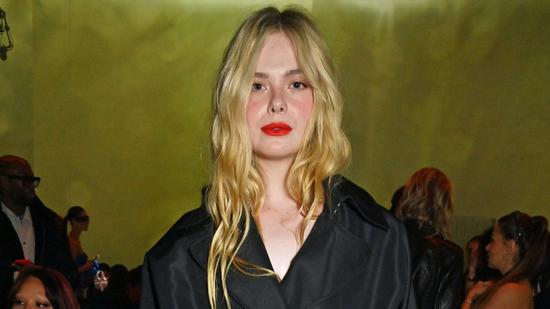Elle Fanning posing at Paris Fashion Week