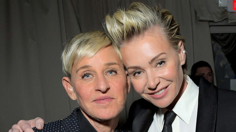 Ellen DeGeneres both with blonde hair and wearing black