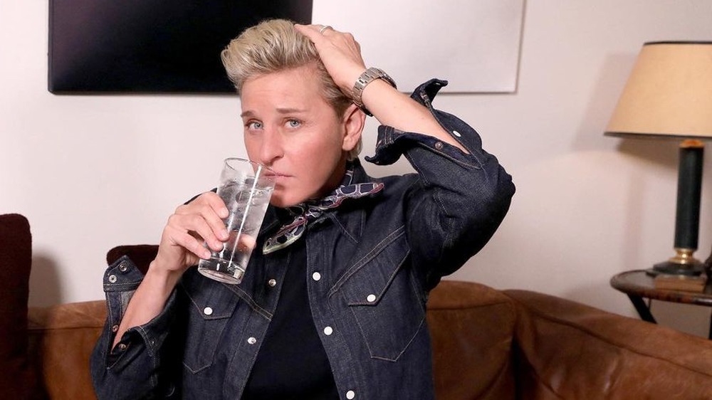 Ellen DeGeneres drinking a glass of water