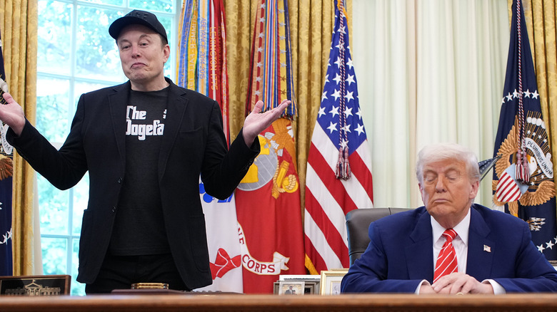 Elon Musk standing next to Donald Trump