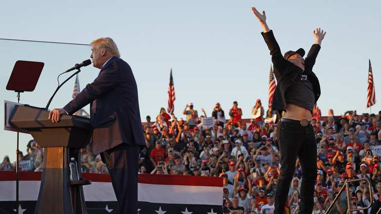 Donald Trump speaking at podium next to Elon Musk