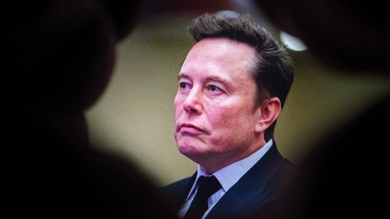 Elon Musk waiting before a congressional hearing