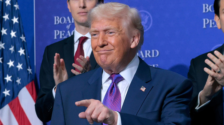 Donald Trump smiling and pointing