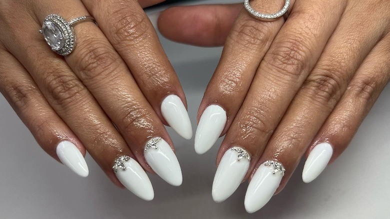 white nails with silver tiara detail