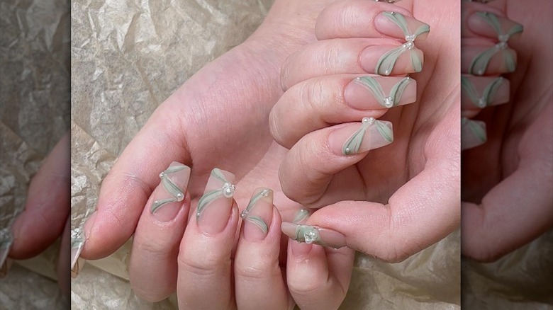 clear with green tulle and pearls