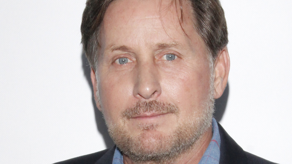 Emilio Estevez slight grin facial hair