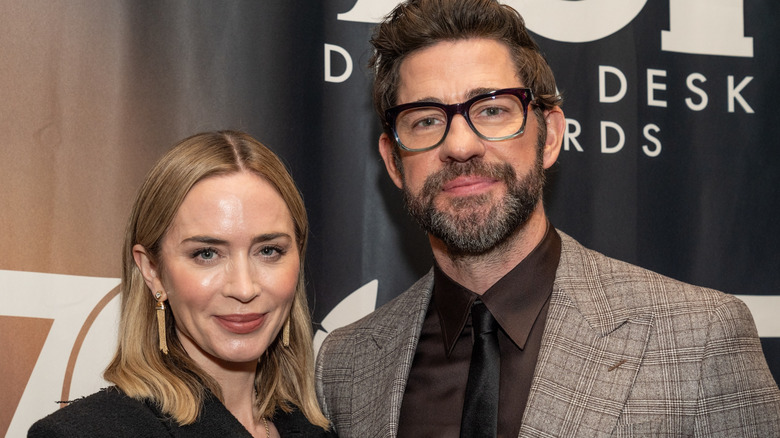 Emily Blunt and John Krasinski smiling into the camera