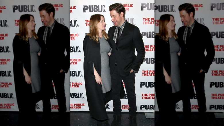 Emily Blunt and John Krasinski smile together on red carpet