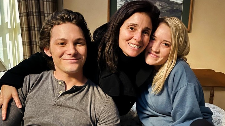 Emily Osment, Montana Jordan, and Shiri Appleby smiling on the set of "Georgie & Mandy's First Marriage"