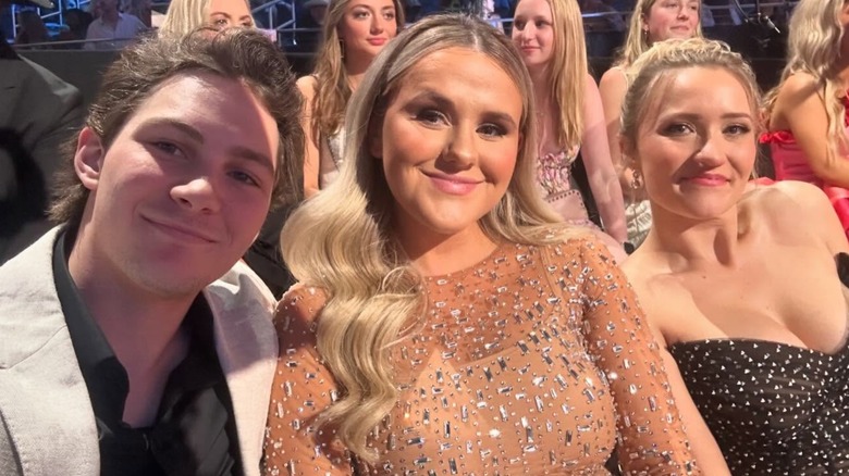 Emily Osment, Jenna Weeks, and Montana Jordan smiling at the CMT Awards in 2024