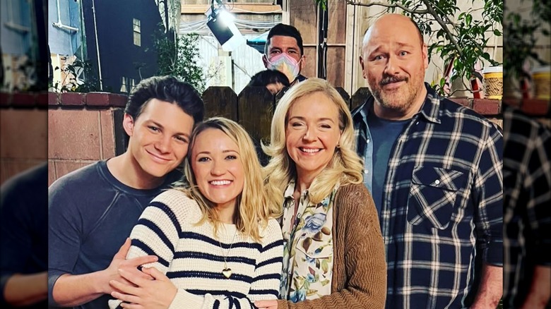 Emily Osment, Jeff Sheets, Montana Jordan, Rachel Bay Jones, and Will Sasso smiling on the set of "Georgie & Mandy's First Marriage"