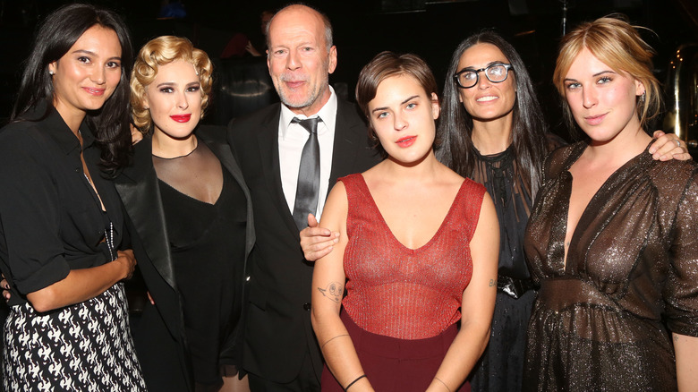 Emma Heming, Rumer Willis, Bruce Willis, Tallulah Belle Willis, Demi Moore and Scout LaRue Willis smiling and posing.